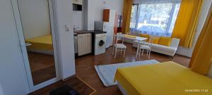 a small apartment with a kitchen and a living room at Къща Поморини Несебър in Nesebar +37 photos