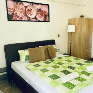 A bed or beds in a room at Attila Studio Apartments