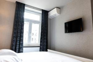 TV a/nebo společenská místnost v ubytování Hotel Bristol