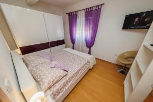 Postel nebo postele na pokoji v ubytování Apartman Marija