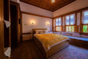 A bed or beds in a room at Meymune Valide Konağı
