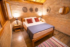 Ein Bett oder Betten in einem Zimmer der Unterkunft Pousada Sonho Meu