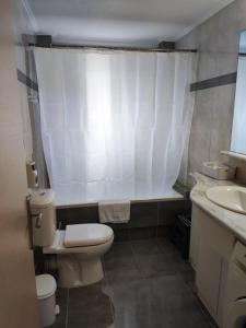 a small bathroom with a toilet and a sink at A&J Apartments or Rooms athens airport in Markopoulo