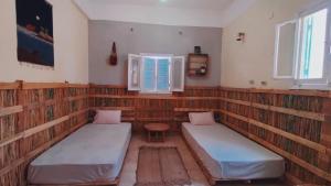 Vuode tai vuoteita majoituspaikassa هوستل أجبناخ إنشالي Hostel Agbenakh Inshaly