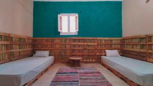 Vuode tai vuoteita majoituspaikassa هوستل أجبناخ إنشالي Hostel Agbenakh Inshaly