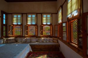 A bed or beds in a room at Meymune Valide Konağı