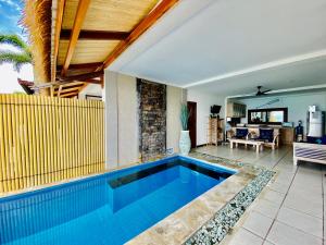 a swimming pool in the middle of a house at Lembongan Sanctuary Villas in Nusa Lembongan