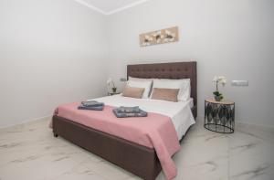 Postel nebo postele na pokoji v ubytování Green Lagoon Villa by "elite"