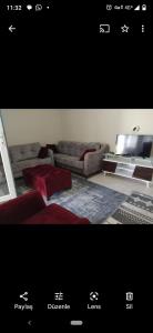 a living room with a couch and a table at Avşa kiralık yazlık ev in Marmara
