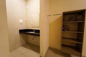 a small bathroom with a sink and a counter at Verdant hotel in Bonito +28 photos