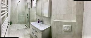 a bathroom with a sink and a shower and a toilet at Old City Hill in Sarajevo