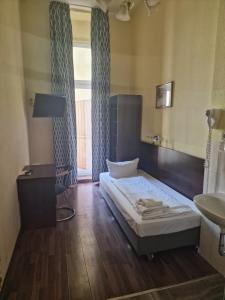 Letto o letti in una camera di Hotel Am Stuttgarter Eck