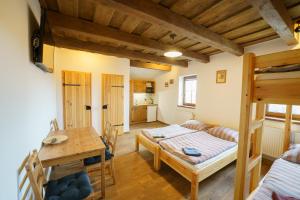 Postel nebo postele na pokoji v ubytování APARTMÁNY PAUSRAM