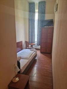 Letto o letti in una camera di Hotel Am Stuttgarter Eck