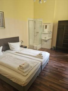 Letto o letti in una camera di Hotel Am Stuttgarter Eck