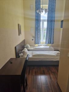 Letto o letti in una camera di Hotel Am Stuttgarter Eck
