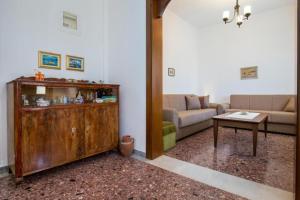 a living room with a couch and a table at Xanthi's Dream Place in Potos