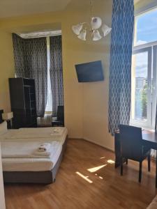TV a/nebo společenská místnost v ubytování Hotel Am Stuttgarter Eck