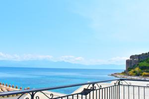 a view of the ocean from a balcony at Apartments Xenios Zeus 1 in Koroni