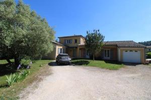 a car parked in front of a house at Villa « les rives de l’Ardèche » in Ucel