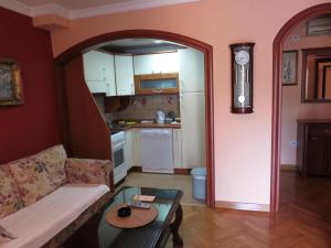 a living room with a couch and a table at Saint Stefan Escape in Sveti Stefan