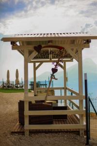 a playground with a gazebo on the beach at LE TERRAZZE SUL GARDA RELAIS in Biaza