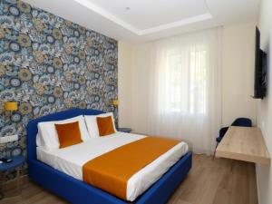 Appartamento Salotto Vomero 7 tesisinde bir odada yatak veya yataklar