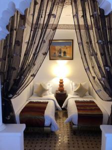 Postel nebo postele na pokoji v ubytování Riad Malida Marrakech