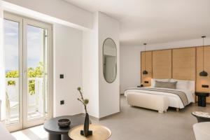 Cama ou camas em um quarto em Grace Mykonos