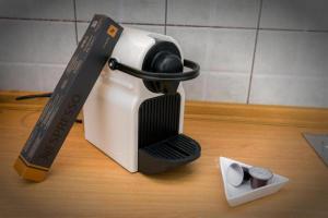 a coffee maker with a knife and a container of matches at Petra Mare Apartments in Alyki