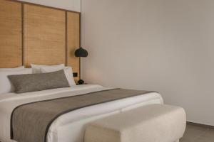 Cama ou camas em um quarto em Grace Mykonos