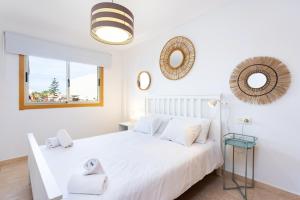 Ένα ή περισσότερα κρεβάτια σε δωμάτιο στο MEDANO Relax Holiday Home +41 φωτογραφίες