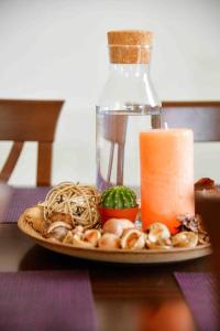 a plate of food on a table with a candle at The Wave in Tivat