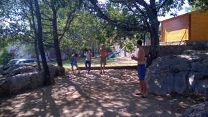 a group of people playing a game of frisbee at Gite Les Cigales in Labeaume