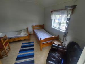 Postel nebo postele na pokoji v ubytování Selholmens Camping