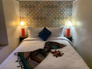 Postel nebo postele na pokoji v ubytování Riad Malida Marrakech