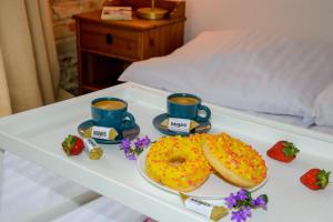 Łóżko lub łóżka w pokoju w obiekcie Maya's Flats & Resorts 19 & 20 - Ogarna