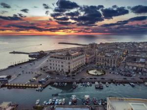 an aerial view of a harbor at sunset at Dimora diaz 23a in Siracusa