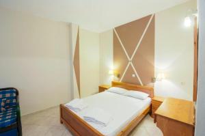 Postel nebo postele na pokoji v ubytování Sotiris Studios