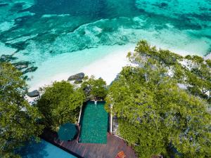 an aerial view of a beach with a swimming pool at JA Enchanted Island Resort Seychelles in Round Island