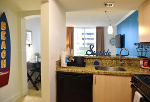 a kitchen with a sink and a counter top at Relaxing Condo Hotel In The Grove, Free Parking in Miami