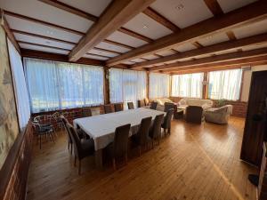 a large dining room with a table and chairs at Villa White Dove Sarajevo in Sarajevo