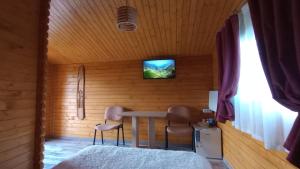 TV a/nebo společenská místnost v ubytování Casa Fericirii