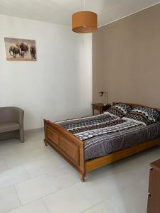 מיטה או מיטות בחדר ב-Le Domaine D Anaelys