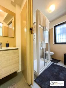 a bathroom with a shower and a toilet and a sink at Casa Valentino - Appartamento con vista in Madonna del Sasso