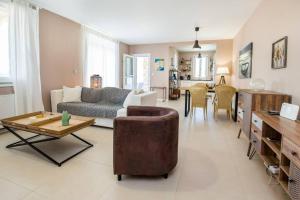 a living room with a couch and a table at Villa Luna in Kavála +36 photos