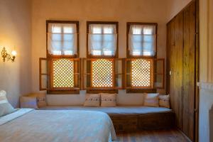 A bed or beds in a room at Meymune Valide Konağı