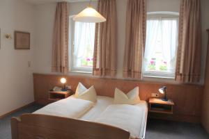 Postel nebo postele na pokoji v ubytování Hotel Bezold
