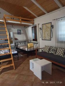 a living room with a couch and a bunk bed at Rare find! Dogs Welcome Secluded Comfy House Krk in Šilo