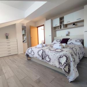 a bedroom with a bed and a wooden floor at New apartments Kunić Sobra-Mljet in Sobra